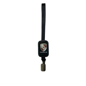 Porsche Crest Headrest Car Hook-Black Leather W/ Metal Hook NIP Measures 11.5”